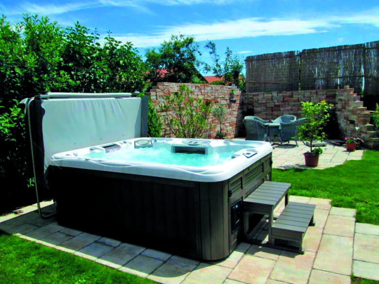 Sundance Spas installed in a backyard.