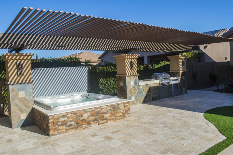 Sundance Spas hot tub under a pergola.